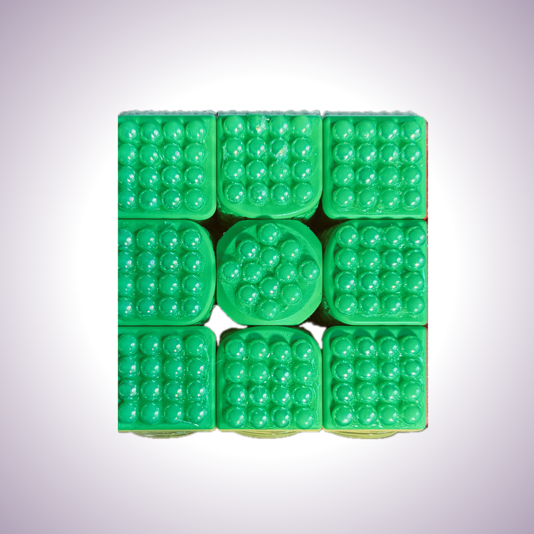 Close up of green side. Each square has a four by four grid of small pearls on it. The center has twelve pearls arranged in a circle.