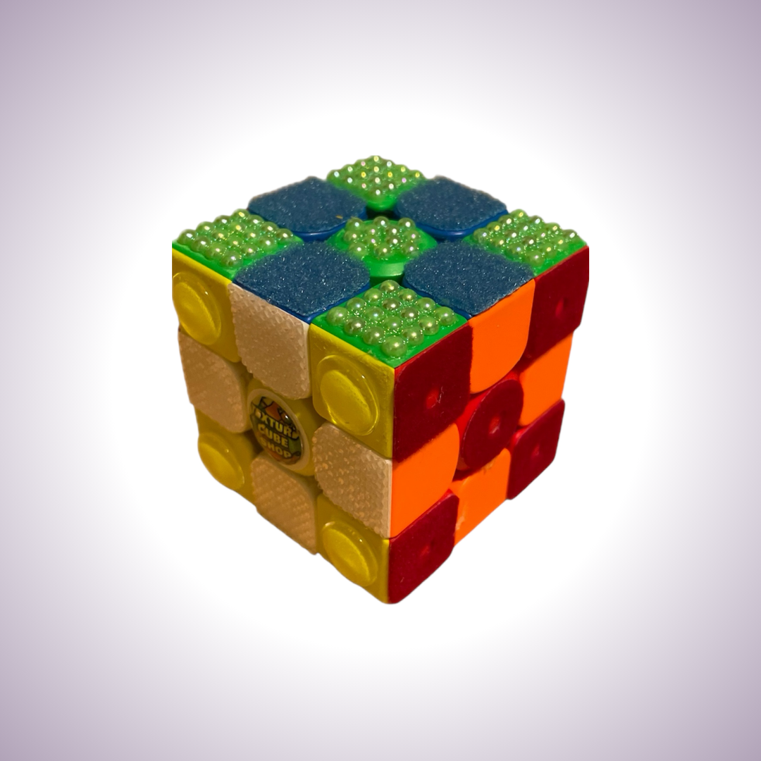 Textured Rubik's Cube in a checkerboard pattern. Different squares have different colros as well as different textures.