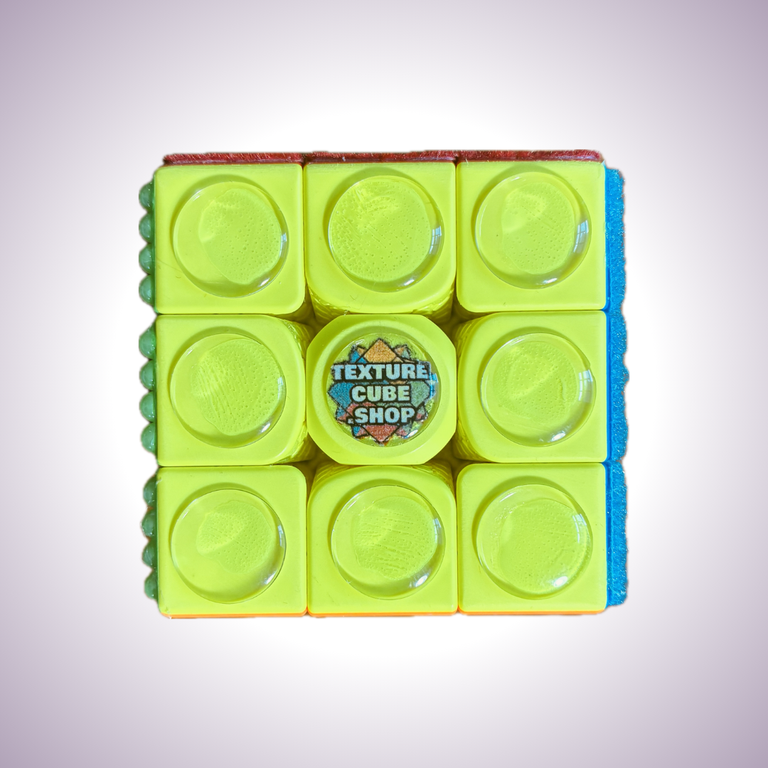 Close up of yellow side. Each square has a glass dome on it.