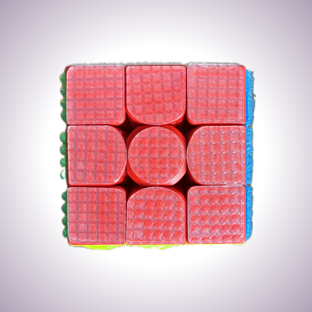 Close up of red side. Texture is grippy and has a grid pattern.